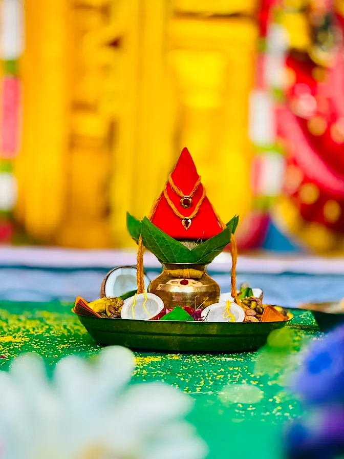 Kalasam and coconut arranged for a traditional ceremony
